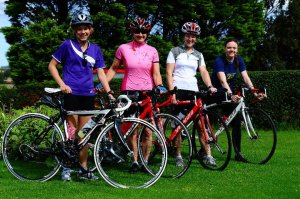 Four women with road bikes