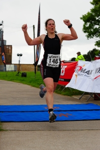 me crossing the finish line at the QE2 sprint triathlon